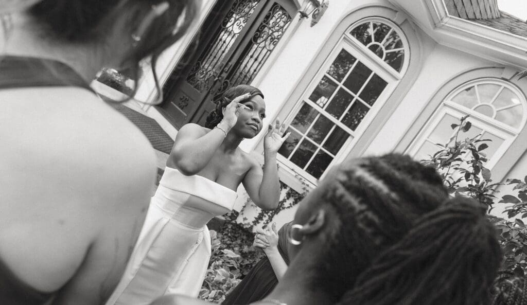 Bride reacting emotionally during first look with bridesmaids at Morais Vineyards venue