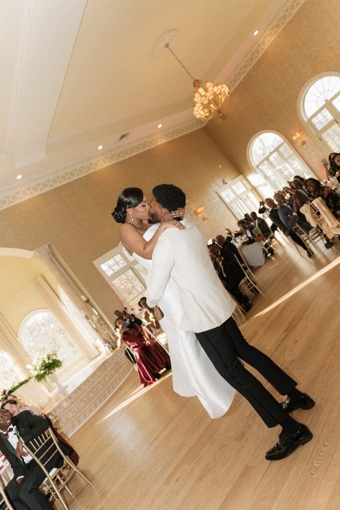 Bride and groom kissing during the first dance