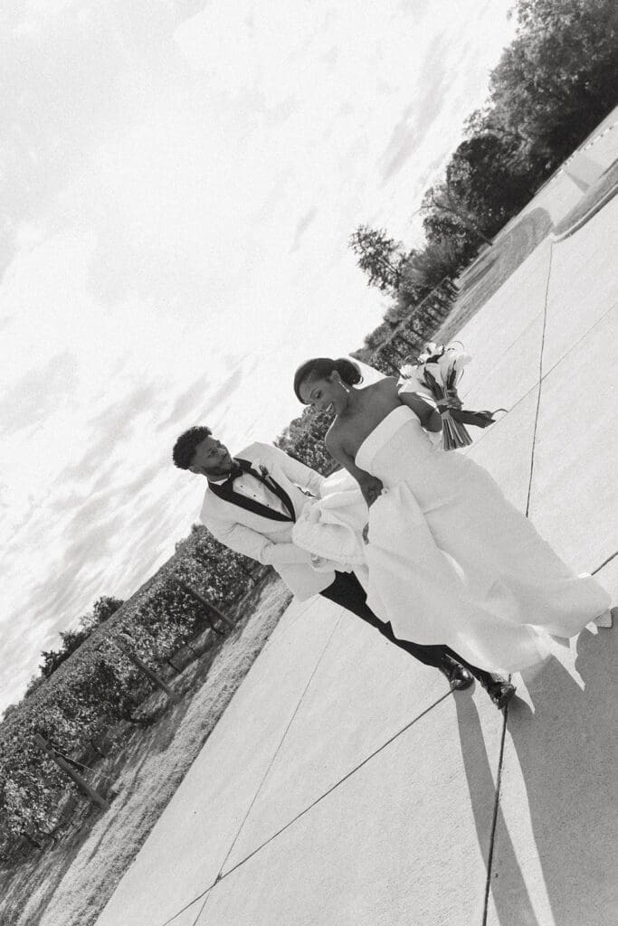 bride and groom walking at Morais Vineyards & Winery in Bealeton Virginia