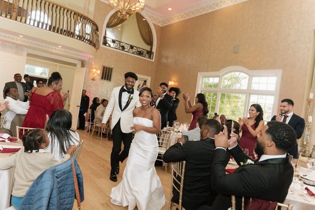bride and groom entering the wedding reception