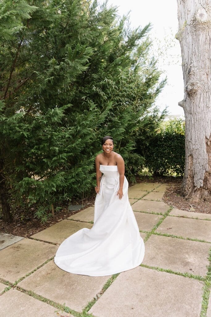 Bride smiling before the first touch at Morais Vineyards wedding
