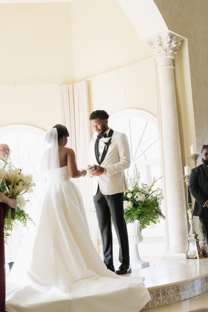 bride and groom reading vows at Morais Vineyards & Winery