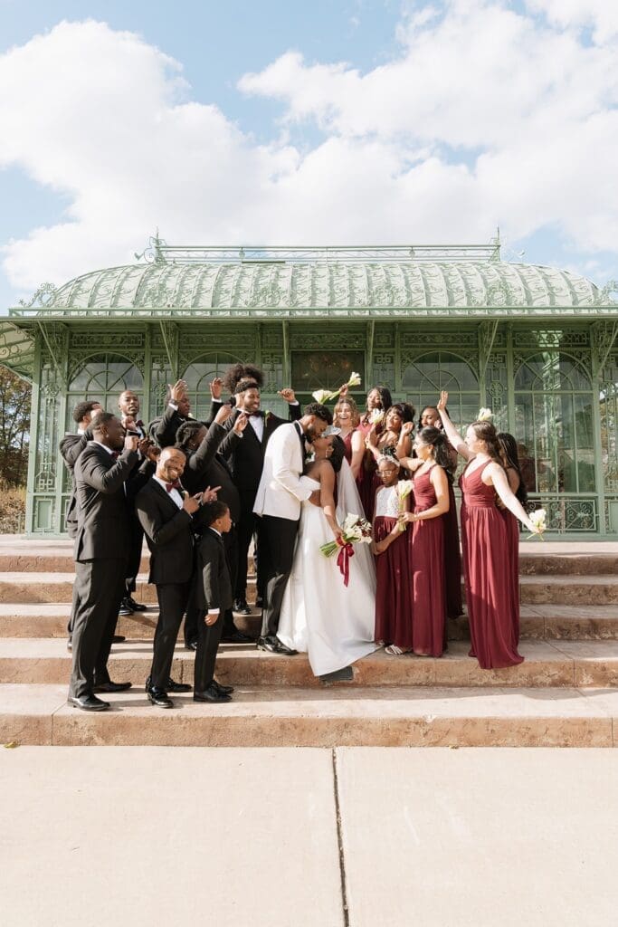 Wedding party cheering outside Morais Vineyards glass house