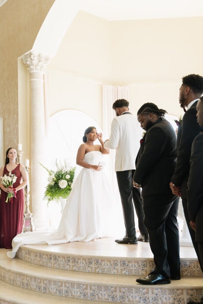 Bride and groom exchanging vows during a ceremony in Morais Vineyards venue