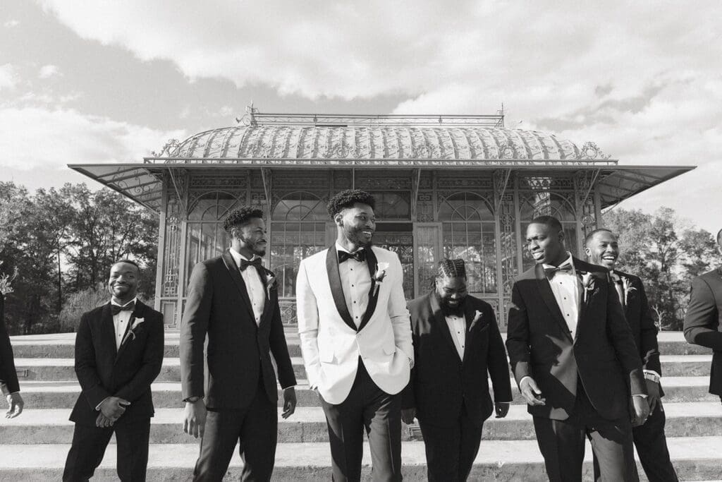 Groom and groomsmen walking outside Morais Vineyard Bealeton VA