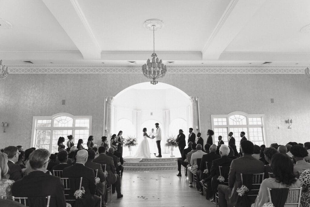 Bride and Groom exchanging vows during indoor Morais Vineyards wedding ceremony