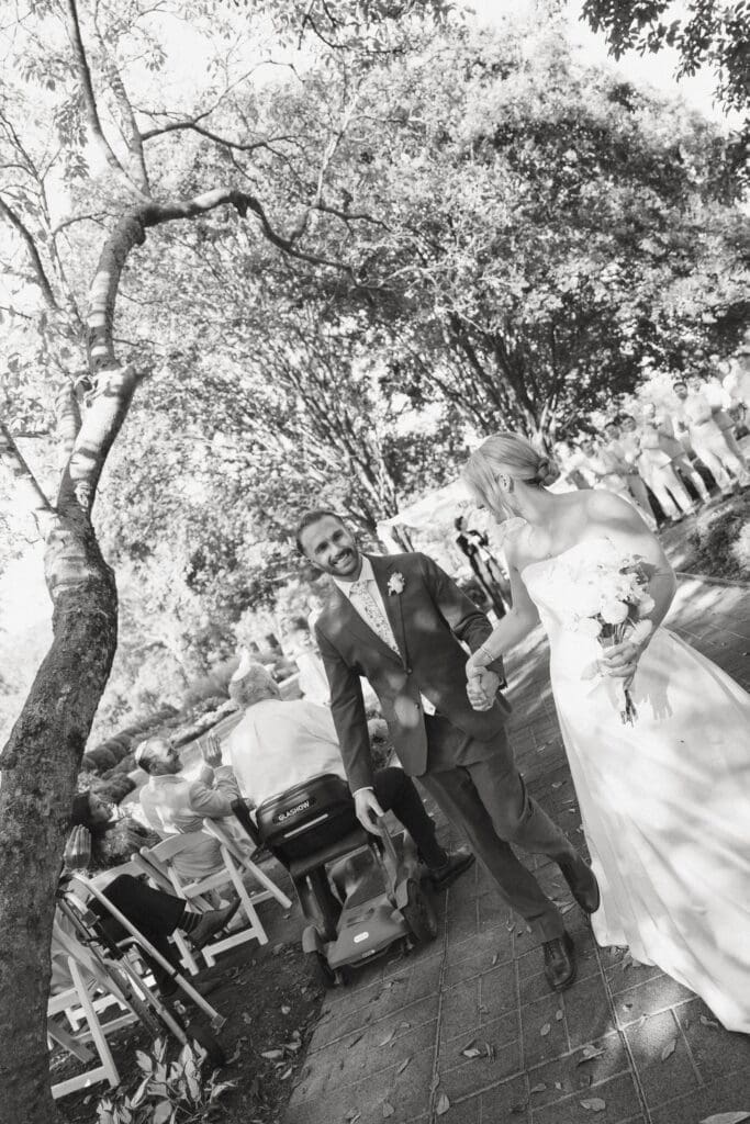 Bride and groom exit after the jewish ceremony at Belmont Manor