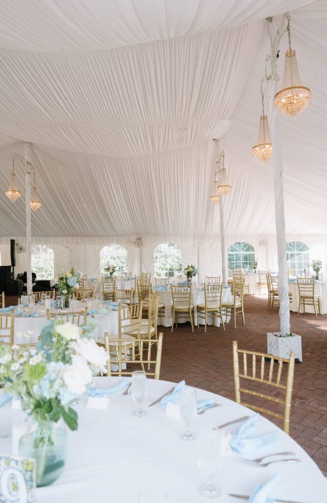 Tented wedding reception setup at Belmont Manor Historic Park
