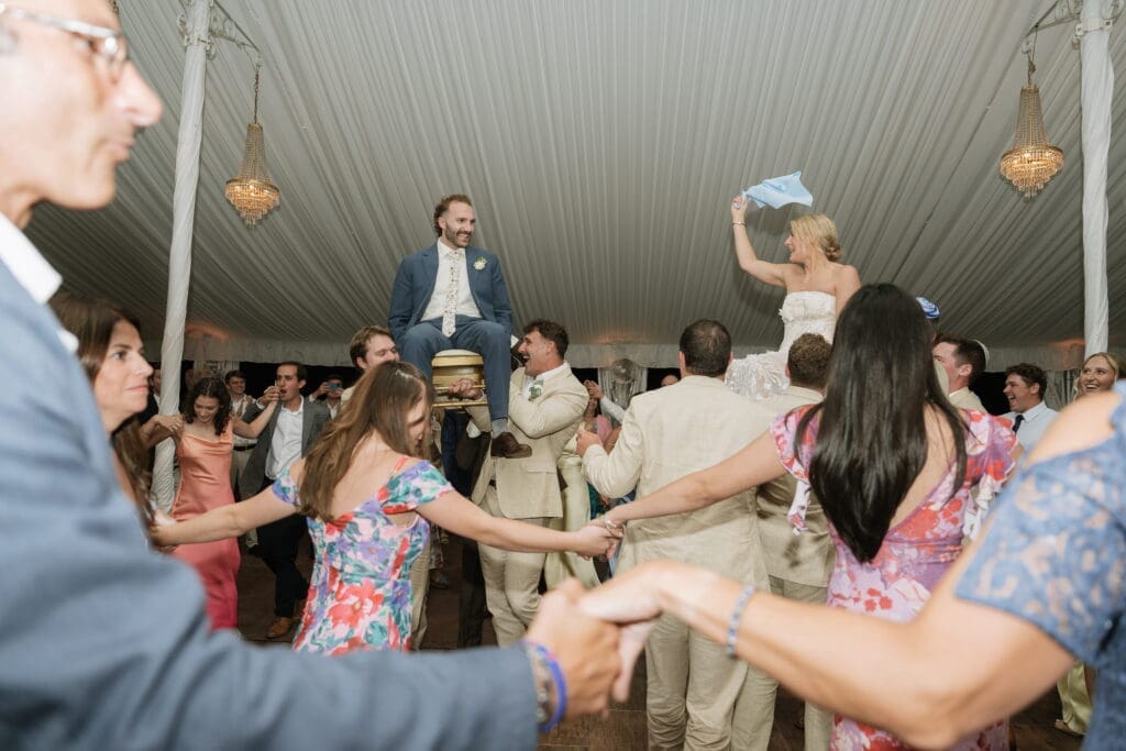Bride and groom during a Jewish wedding hora