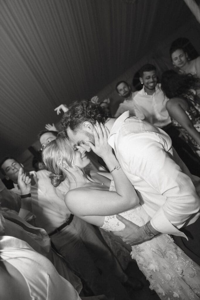 Candid Belmont Manor wedding photo of Eleanor and Jacob dancing at their reception