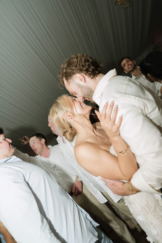 Candid bride and groom dancing during Belmont Manor wedding reception