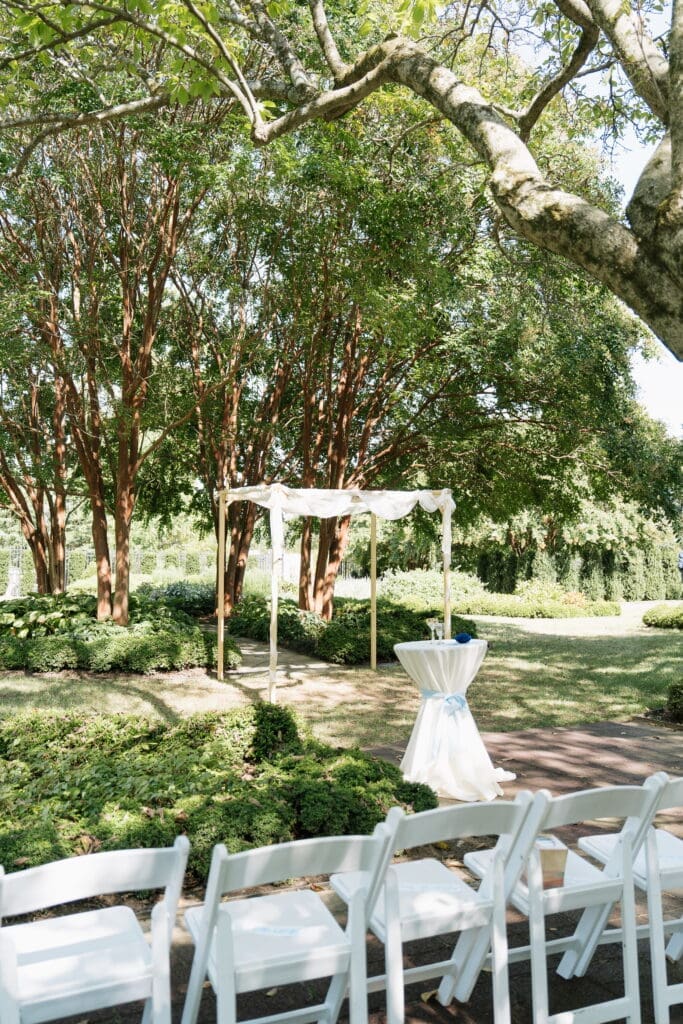 Jewish wedding garden ceremony setup with chuppah at Belmont Manor