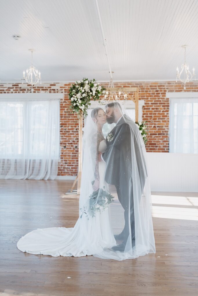Elegant indoor wedding portraits at The Woolen Mill in Fredericksburg, Virginia.