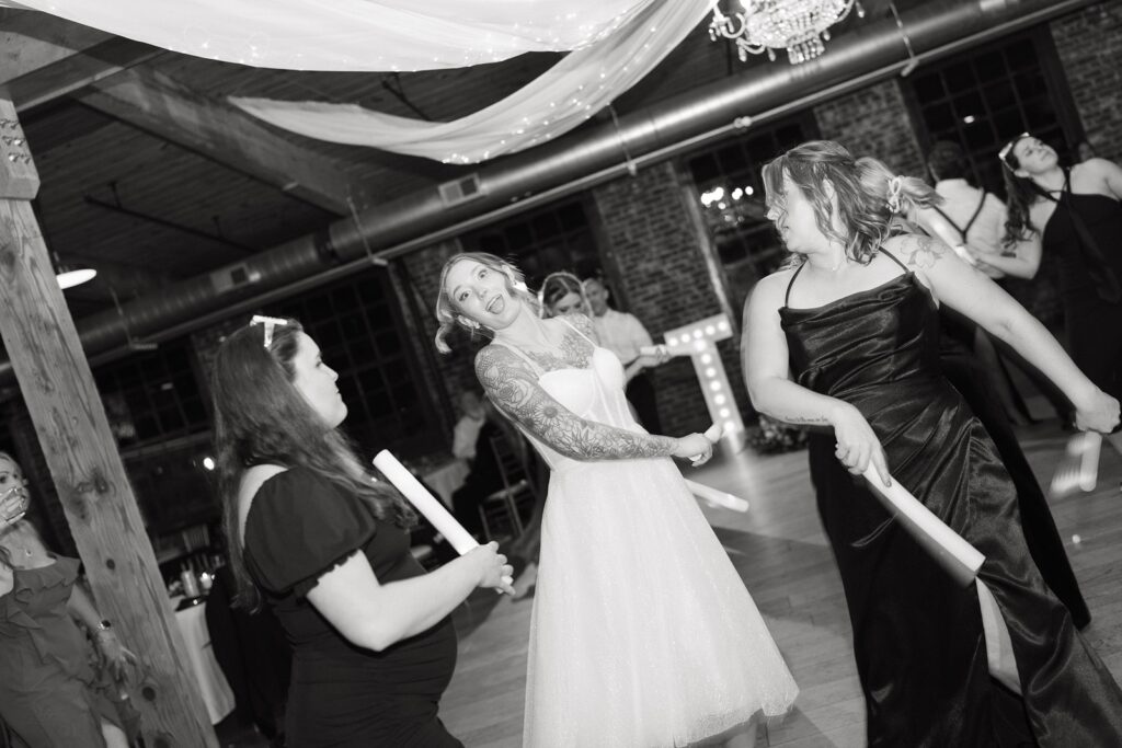 Bride dancing during a The Woolen Mill Wedding reception.