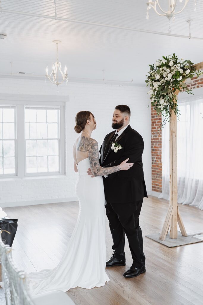 Bride and groom sharing an emotional first look before their wedding ceremony.