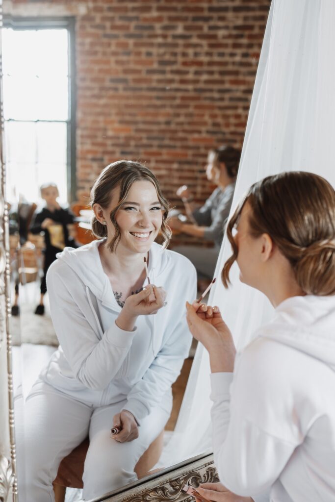 Bride smiling while getting ready for her wedding in Fredericksburg, Virginia.