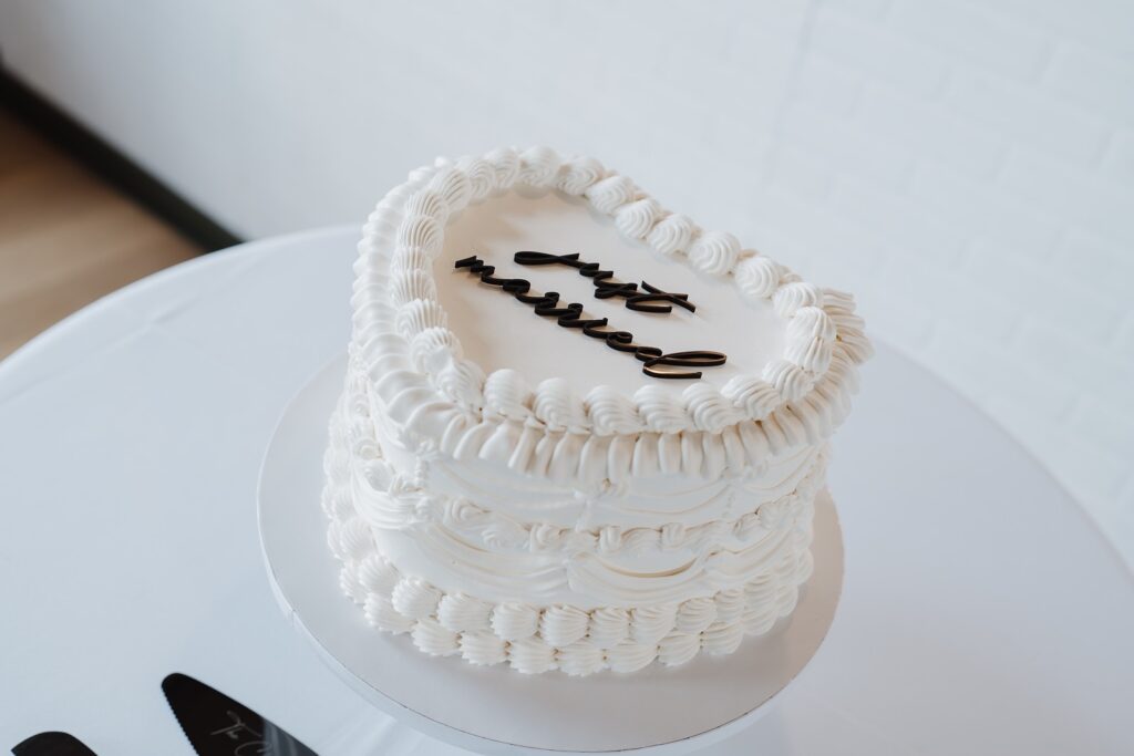 Wedding cake displayed during The Woolen Mill wedding reception.