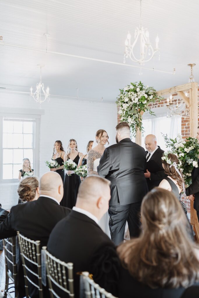 Bride and groom exchanging vows during their wedding ceremony.