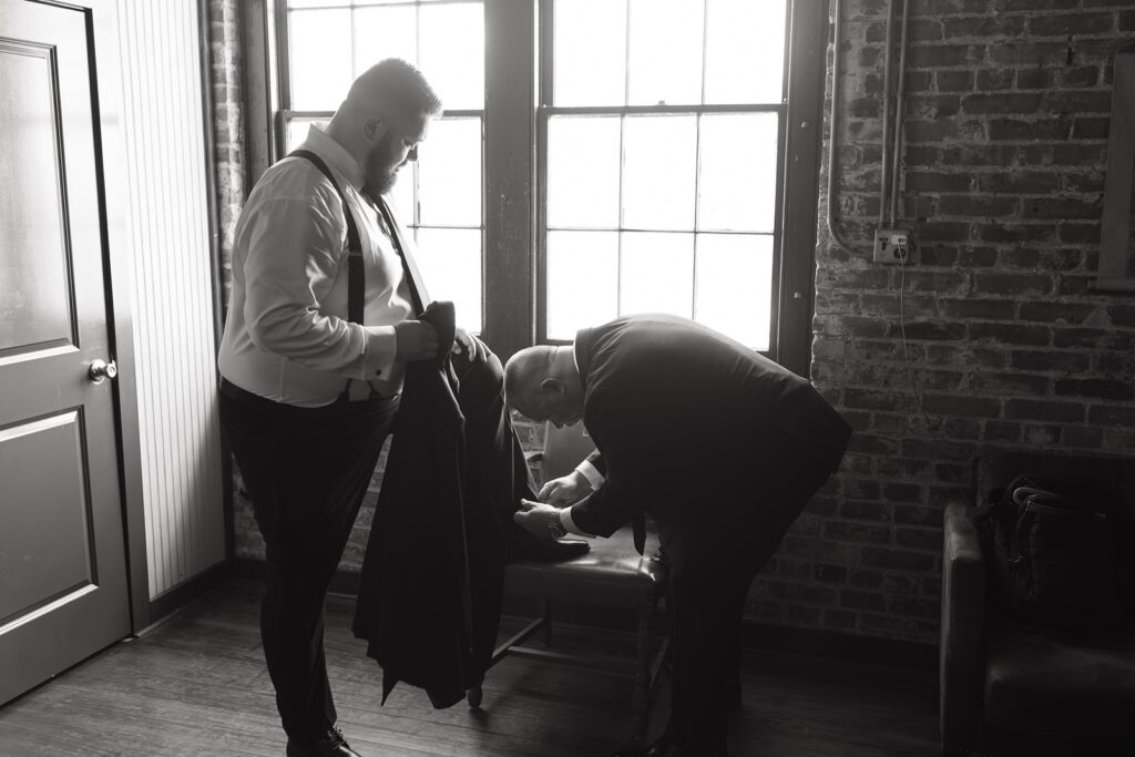 Groom getting ready before his wedding at The Woolen Mill.