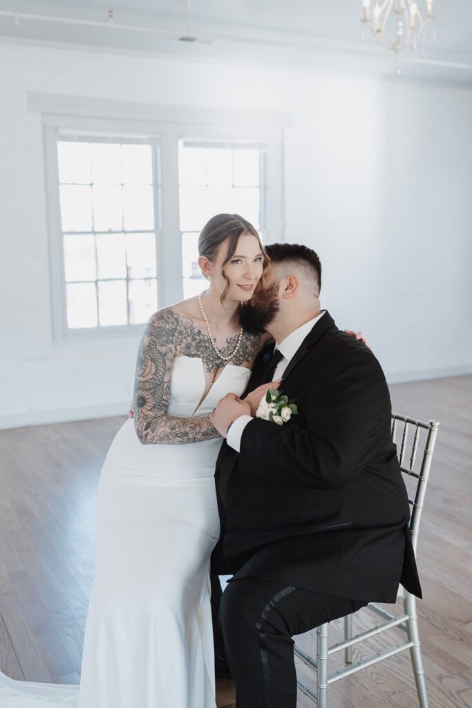 Bride and groom sharing a quiet moment together before the ceremony.