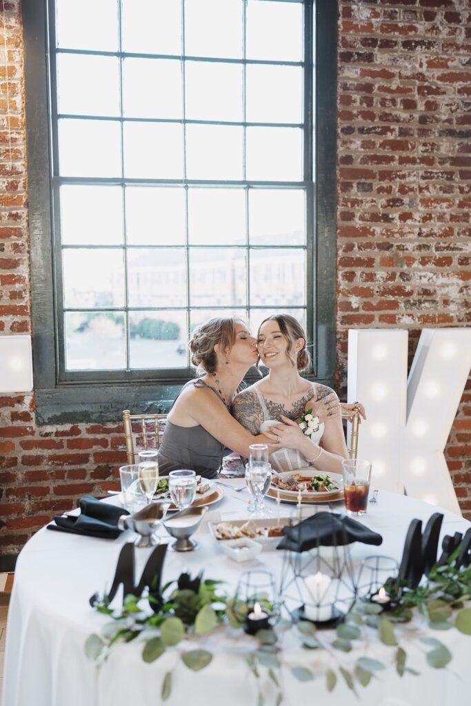 Bride and her mom during an emotional moment at The Woolen Mill.